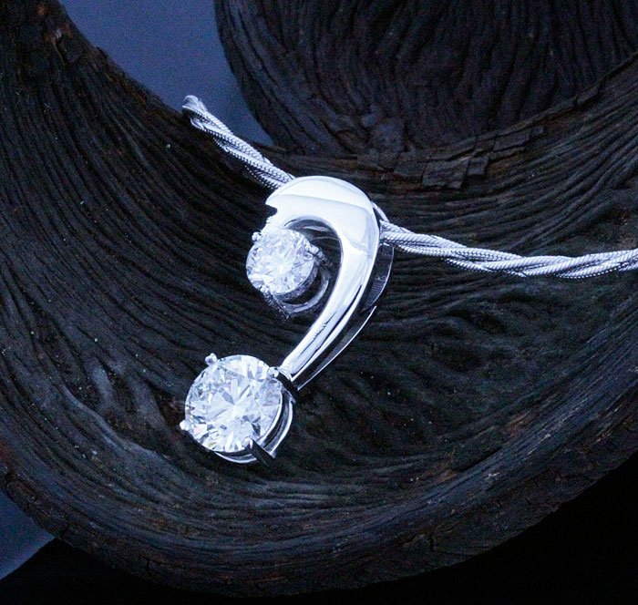 Customer’s diamond being set into a custom-designed Kaz Jewelry engagement ring, highlighting personalized craftsmanship and bespoke service.